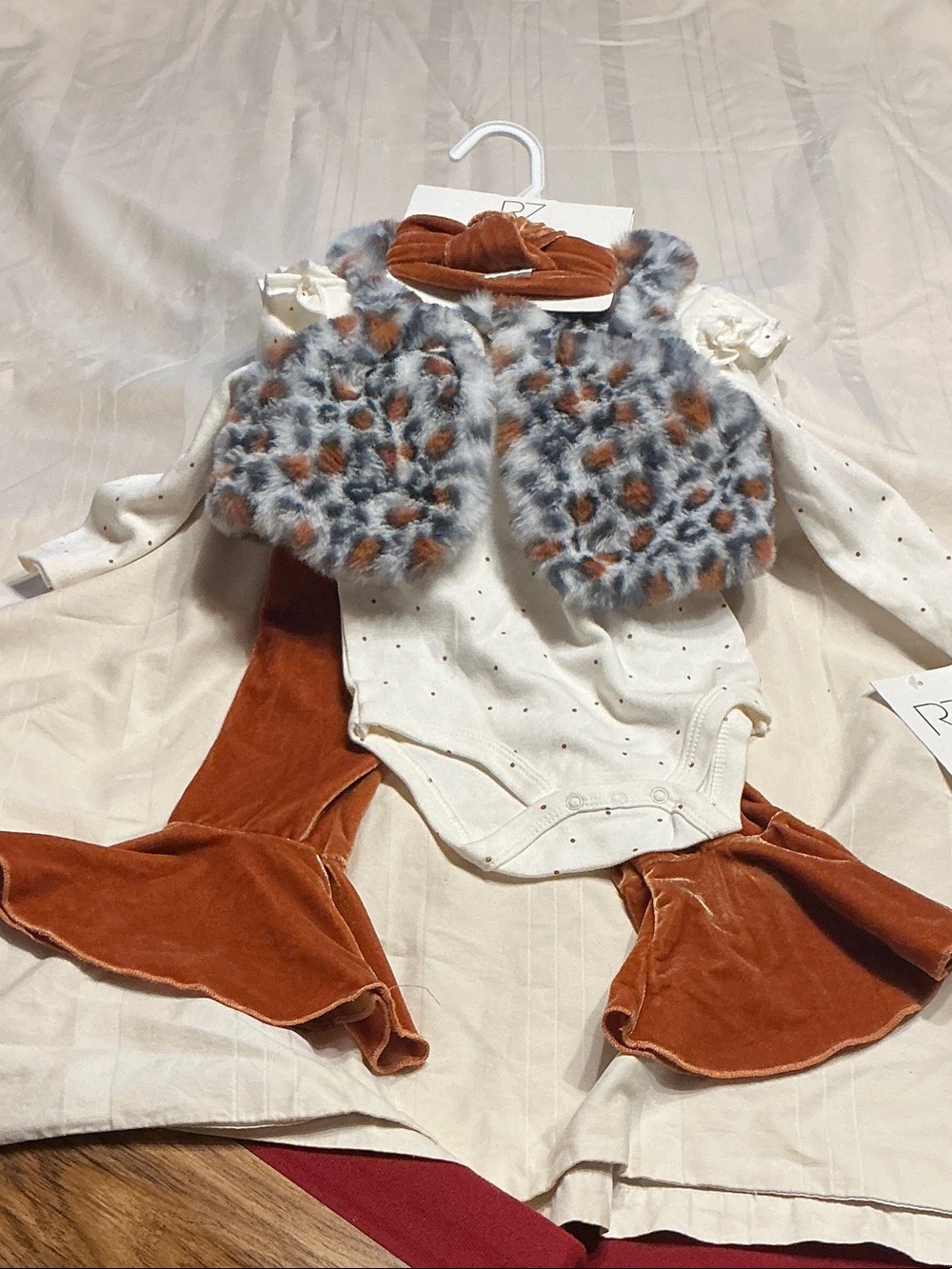 Rachel Zoe Cream Dot Bodysuit with Rust Velvet Pants and Faux Fur Leopard Vest